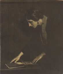 Carlotta Monterey looking at scrapbook